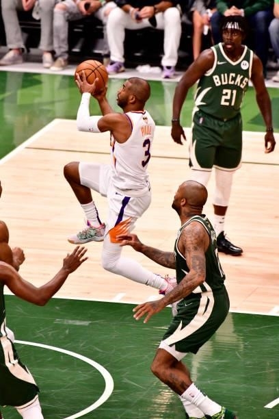 July 11: Chris Paul of the Phoenix Suns drives to the basket against the Milwaukee Bucks during Game Three of the 2021 NBA Finals on July 11, 2021 at...