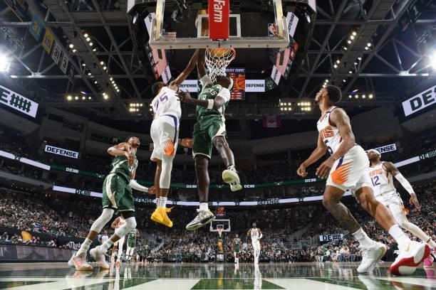 Bobby Portis of the Milwaukee Bucks drives to the basket as Mikal Bridges of the Phoenix Suns plays defense during Game Three of the 2021 NBA Finals...