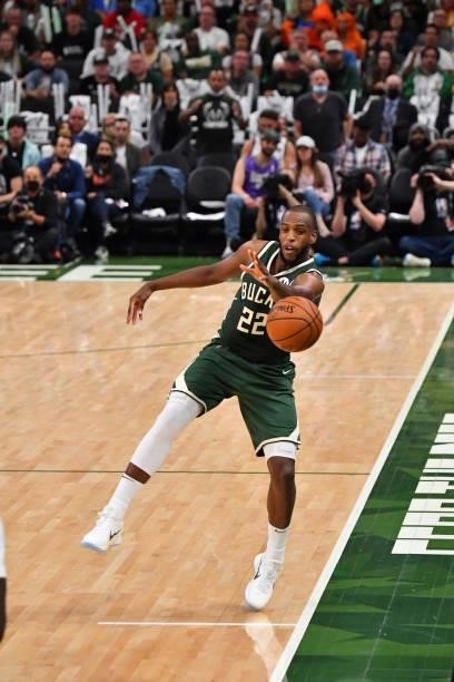 Khris Middleton of the Milwaukee Bucks passes the ball against the Phoenix Suns during Game Three of the 2021 NBA Finals on July 11, 2021 at Fiserv...