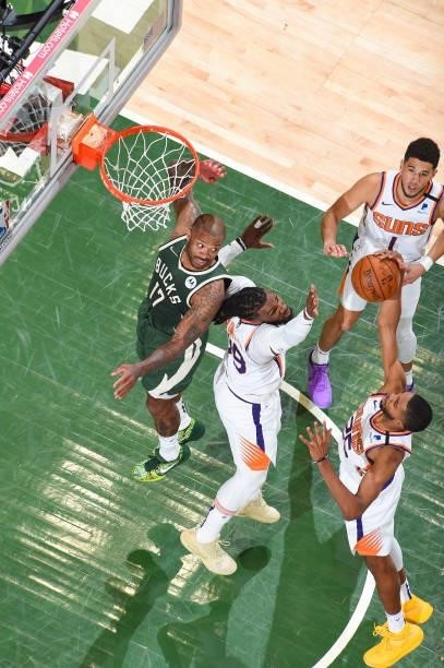 Mikal Bridges of the Phoenix Suns rebounds the ball during the game against the Milwaukee Bucks during Game Three of the 2021 NBA Finals on July 11,...