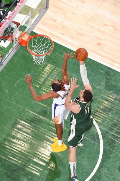 Brook Lopez of the Milwaukee Bucks drives to the basket during the game against the Phoenix Suns during Game Three of the 2021 NBA Finals on July 11,...