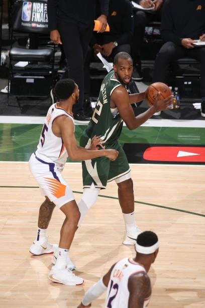 Khris Middleton of the Milwaukee Bucks handles the ball during the game against the Phoenix Suns during Game Three of the 2021 NBA Finals on July 11,...