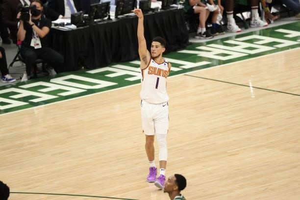 Devin Booker of the Phoenix Suns shoots a three-pointer during the game against the Milwaukee Bucks during Game Three of the 2021 NBA Finals on July...