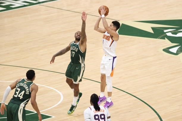 Tucker of the Milwaukee Bucks plays defense during the game against Devin Booker of the Phoenix Suns during Game Three of the 2021 NBA Finals on July...