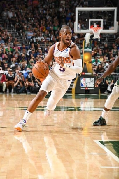 Chris Paul of the Phoenix Suns handles the ball during the game against the Milwaukee Bucks during Game Three of the 2021 NBA Finals on July 11, 2021...