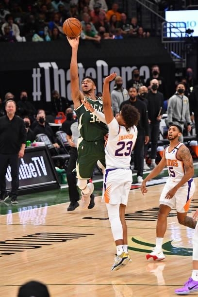 Giannis Antetokounmpo of the Milwaukee Bucks shoots a three-pointer against the Phoenix Suns during Game Three of the 2021 NBA Finals on July 11,...