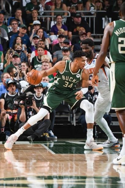 Giannis Antetokounmpo of the Milwaukee Bucks handles the ball during the game against the Phoenix Suns during Game Three of the 2021 NBA Finals on...