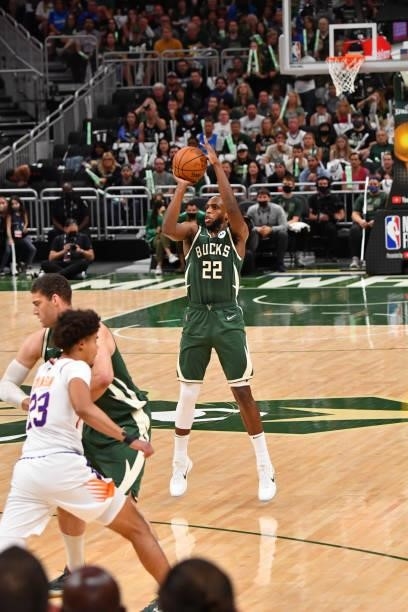 Khris Middleton of the Milwaukee Bucks shoots a three-pointer against the Phoenix Suns during Game Three of the 2021 NBA Finals on July 11, 2021 at...