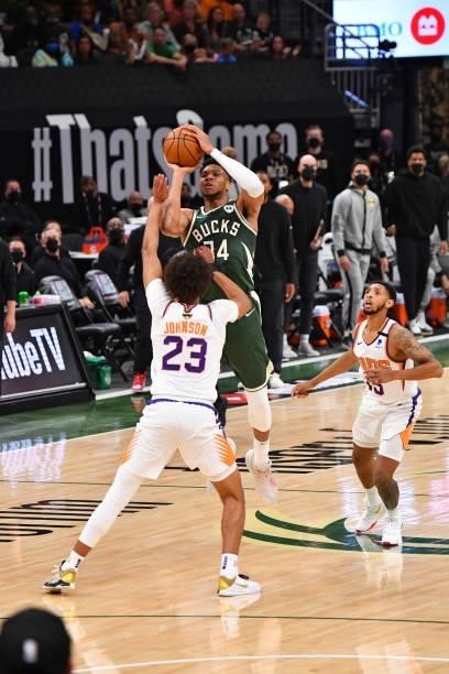 Giannis Antetokounmpo of the Milwaukee Bucks shoots a three-pointer against the Phoenix Suns during Game Three of the 2021 NBA Finals on July 11,...