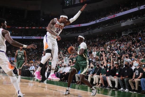 Torrey Craig of the Phoenix Suns plays defense on Bobby Portis of the Milwaukee Bucks during Game Three of the 2021 NBA Finals on July 11, 2021 at...