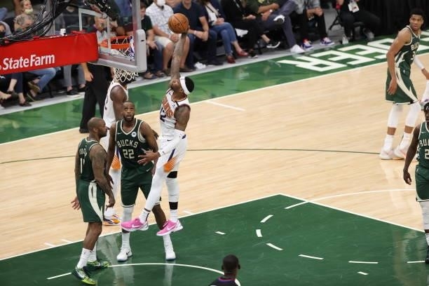 Torrey Craig of the Phoenix Suns dunks the ball during the game against the Milwaukee Bucks during Game Three of the 2021 NBA Finals on July 11, 2021...