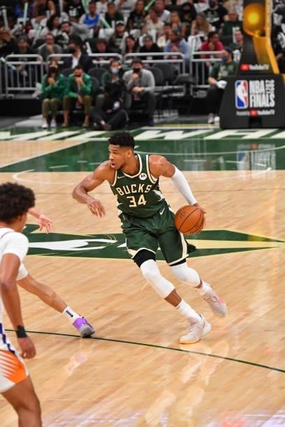 Giannis Antetokounmpo of the Milwaukee Bucks handles the ball against the Phoenix Suns during Game Three of the 2021 NBA Finals on July 11, 2021 at...