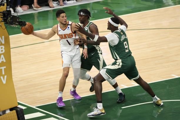 Devin Booker of the Phoenix Suns passes the ball during the game against the Milwaukee Bucks during Game Three of the 2021 NBA Finals on July 11,...