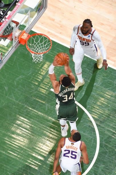 Giannis Antetokounmpo of the Milwaukee Bucks dunks the ball during the game against the Phoenix Suns during Game Three of the 2021 NBA Finals on July...