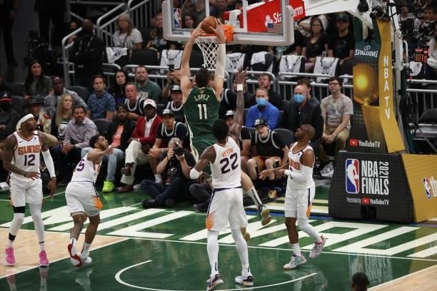 Brook Lopez of the Milwaukee Bucks dunks the ball during the game against the Phoenix Suns during Game Three of the 2021 NBA Finals on July 11, 2021...