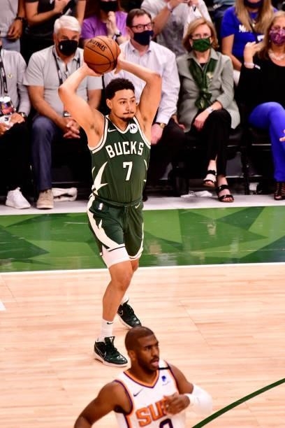 July 11: Bryn Forbes of the Milwaukee Bucks passes the ball against the Phoenix Suns during Game Three of the 2021 NBA Finals on July 11, 2021 at the...