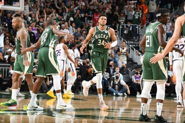 Giannis Antetokounmpo of the Milwaukee Bucks reacts to his dunk during the game against the Phoenix Suns during Game Three of the 2021 NBA Finals on...