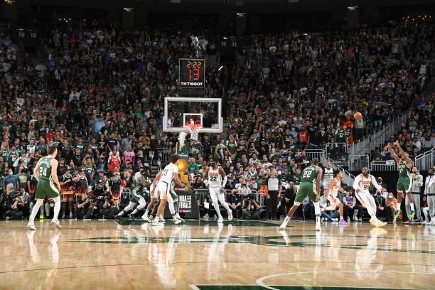 Tucker of the Milwaukee Bucks shoots a three point basket during the game against the Phoenix Suns during Game Three of the 2021 NBA Finals on July...