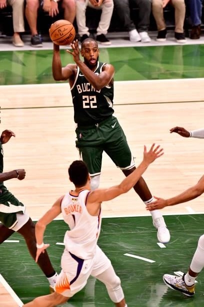 July 11: Khris Middleton of the Milwaukee Bucks passes the ball against the Phoenix Suns during Game Three of the 2021 NBA Finals on July 11, 2021 at...