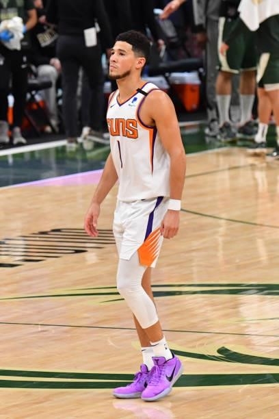 Devin Booker of the Phoenix Suns looks on during Game Three of the 2021 NBA Finals on July 11, 2021 at Fiserv Forum in Milwaukee, Wisconsin. NOTE TO...