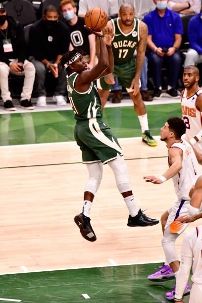 July 11: Jrue Holiday of the Milwaukee Bucks shoots the ball against the Phoenix Suns during Game Three of the 2021 NBA Finals on July 11, 2021 at...