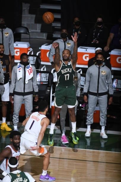 July 11: P.J. Tucker of the Milwaukee Bucks shoots a three point basket against the Phoenix Suns during Game Three of the 2021 NBA Finals on July 11,...