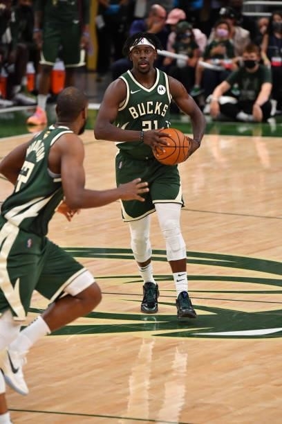 Jrue Holiday of the Milwaukee Bucks passes the ball against the Phoenix Suns during Game Three of the 2021 NBA Finals on July 11, 2021 at Fiserv...