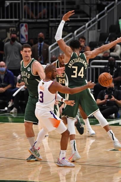 Chris Paul of the Phoenix Suns passes the ball against the Milwaukee Bucks during Game Three of the 2021 NBA Finals on July 11, 2021 at Fiserv Forum...