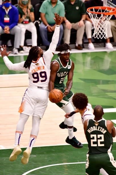 July 11: Jrue Holiday of the Milwaukee Bucks passes the ball against the Phoenix Suns during Game Three of the 2021 NBA Finals on July 11, 2021 at...