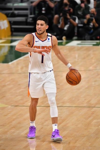 Devin Booker of the Phoenix Suns handles the ball against the Milwaukee Bucks during Game Three of the 2021 NBA Finals on July 11, 2021 at Fiserv...