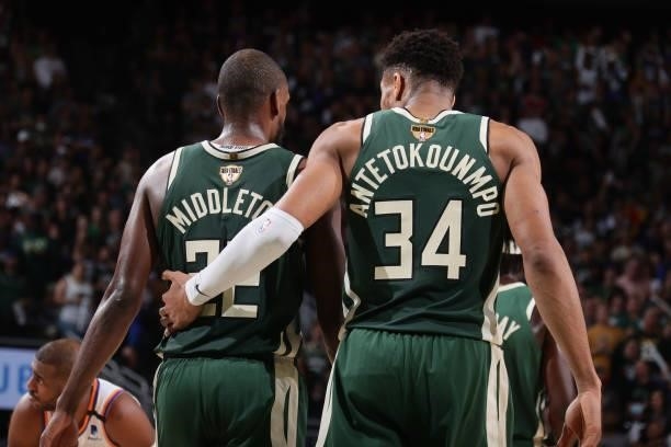 Khris Middleton and Giannis Antetokounmpo of the Milwaukee Bucks talk during Game Three of the 2021 NBA Finals on July 11, 2021 at the Fiserv Forum...