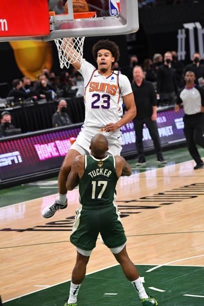 Cameron Johnson of the Phoenix Suns dunks the ball against P.J. Tucker of the Milwaukee Bucks during Game Three of the 2021 NBA Finals on July 11,...