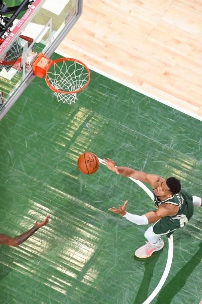 Giannis Antetokounmpo of the Milwaukee Bucks rebounds the ball during the game against the Phoenix Suns during Game Three of the 2021 NBA Finals on...