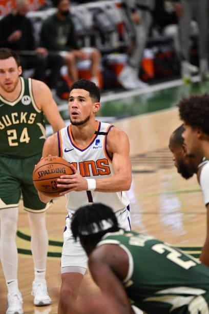 Devin Booker of the Phoenix Suns shoots a free throw during Game Three of the 2021 NBA Finals on July 11, 2021 at Fiserv Forum in Milwaukee,...