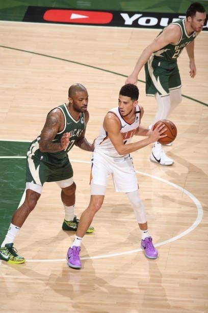Devin Booker of the Phoenix Suns handles the ball during the game against the Milwaukee Bucks during Game Three of the 2021 NBA Finals on July 11,...