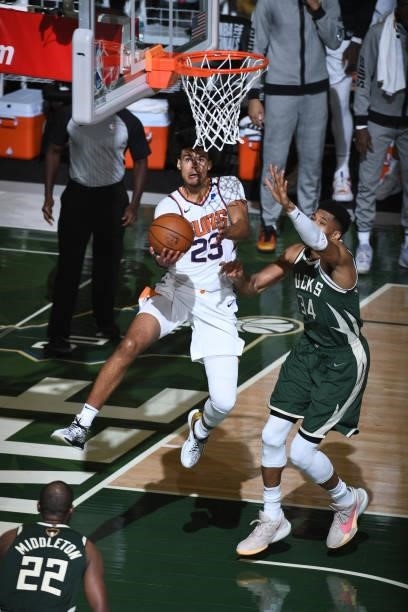 July 11: Cameron Johnson of the Phoenix Suns drives to the basket against the Milwaukee Bucks during Game Three of the 2021 NBA Finals on July 11,...