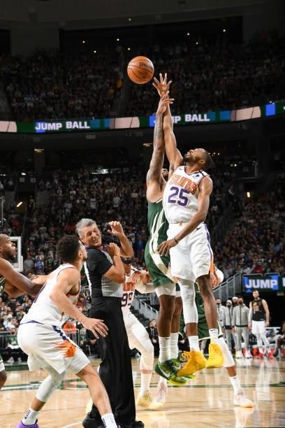 Mikal Bridges of the Phoenix Suns reaches for the jump ball during the game against the Milwaukee Bucks during Game Three of the 2021 NBA Finals on...