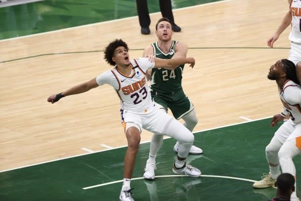 Cameron Johnson of the Phoenix Suns plays defense during the game against the Milwaukee Bucks during Game Three of the 2021 NBA Finals on July 11,...