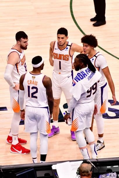 July 11: The Phoenix Suns huddle up during Game Three of the 2021 NBA Finals on July 11, 2021 at the Fiserv Forum Center in Milwaukee, Wisconsin....