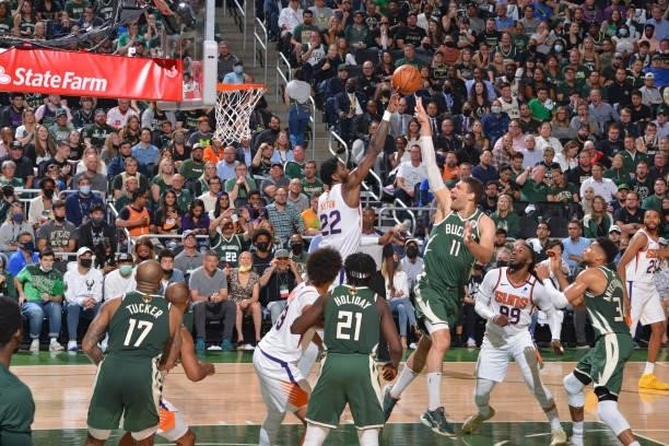 Deandre Ayton of the Phoenix Suns blocks the shot of Brook Lopez of the Milwaukee Bucks during Game Three of the 2021 NBA Finals on July 11, 2021 at...