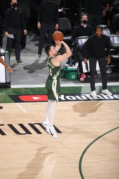 Pat Connaughton of the Milwaukee Bucks shoots a three-pointer during the game against the Phoenix Suns during Game Three of the 2021 NBA Finals on...