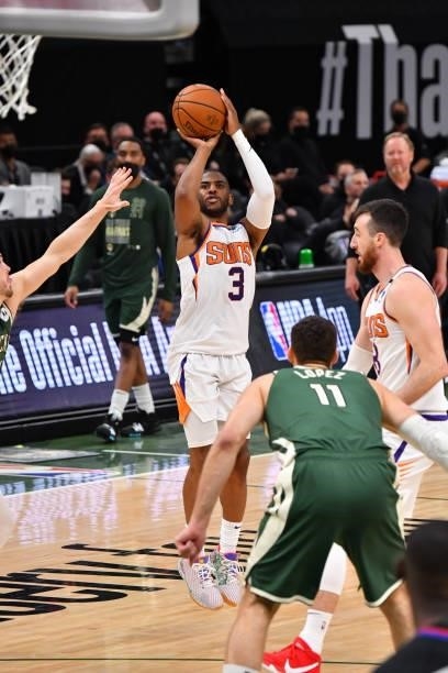 Chris Paul of the Phoenix Suns shoots a three-pointer against the Milwaukee Bucks during Game Three of the 2021 NBA Finals on July 11, 2021 at Fiserv...