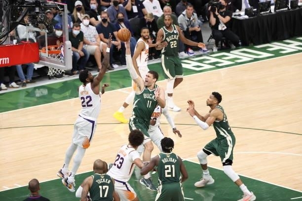 Brook Lopez of the Milwaukee Bucks shoots the ball during the game against the Phoenix Suns during Game Three of the 2021 NBA Finals on July 11, 2021...
