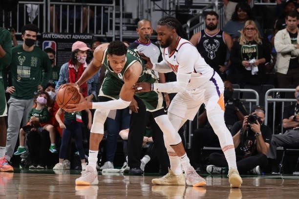 Jae Crowder of the Phoenix Suns plays defense on Giannis Antetokounmpo of the Milwaukee Bucks during Game Three of the 2021 NBA Finals on July 11,...