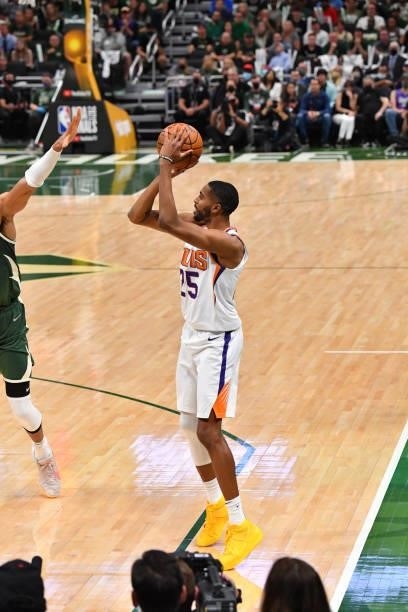 Mikal Bridges of the Phoenix Suns shoots a three-pointer against the Milwaukee Bucks during Game Three of the 2021 NBA Finals on July 11, 2021 at...