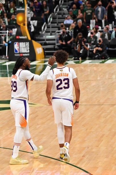 Jae Crowder of the Phoenix Suns and Cameron Johnson of the Phoenix Suns react during Game Three of the 2021 NBA Finals on July 11, 2021 at Fiserv...