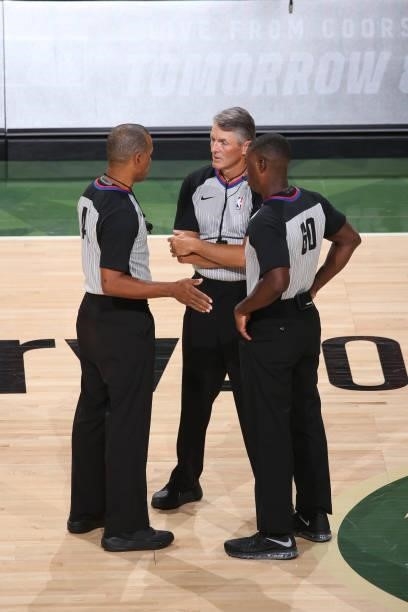 Official Scott Foster talks to other officials during the Milwaukee Bucks game against the Phoenix Suns during Game Three of the 2021 NBA Finals on...