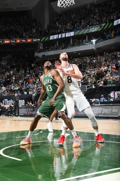 Thanasis Antetokounmpo of the Milwaukee Bucks and Frank Kaminsky of the Phoenix Suns fight for position during Game Three of the 2021 NBA Finals on...