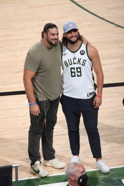 Player David Bakhtiari poses with Dana Beers of Barstool Sports after the Milwaukee Bucks game against the Phoenix Suns during Game Three of the 2021...