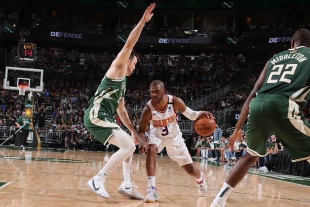 Chris Paul of the Phoenix Suns dribbles the ball during Game Three of the 2021 NBA Finals on July 11, 2021 at the Fiserv Forum Center in Milwaukee,...